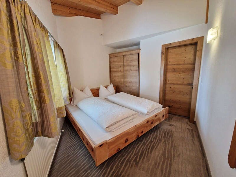 Double bedroom with wardrobe in apartment 1