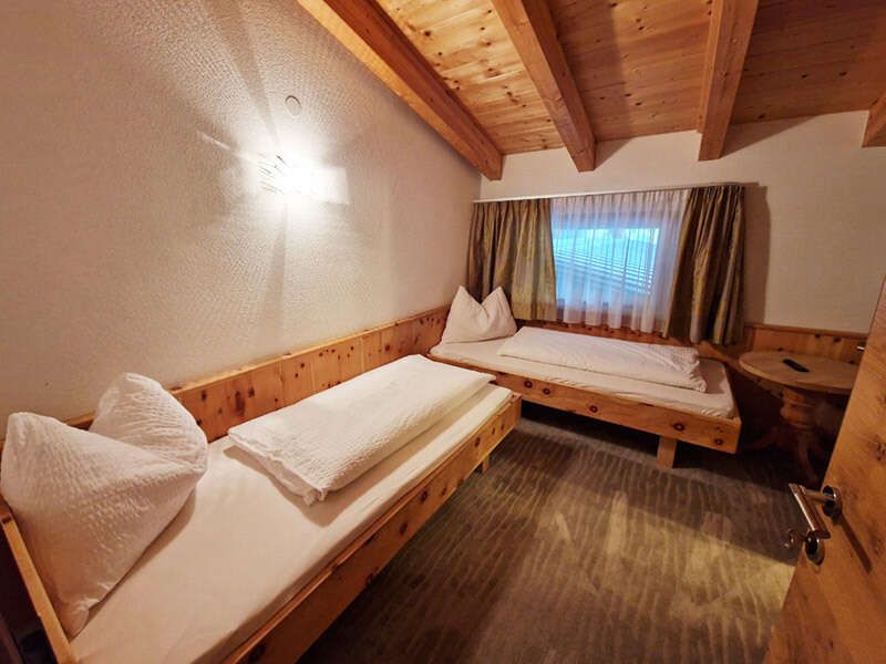 Two single beds in the children's room in apartment 3