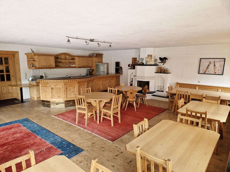 Common room with kitchen and wood-burning stove