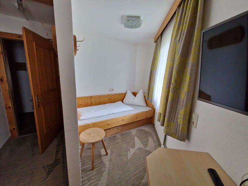 Single bed in a triple room